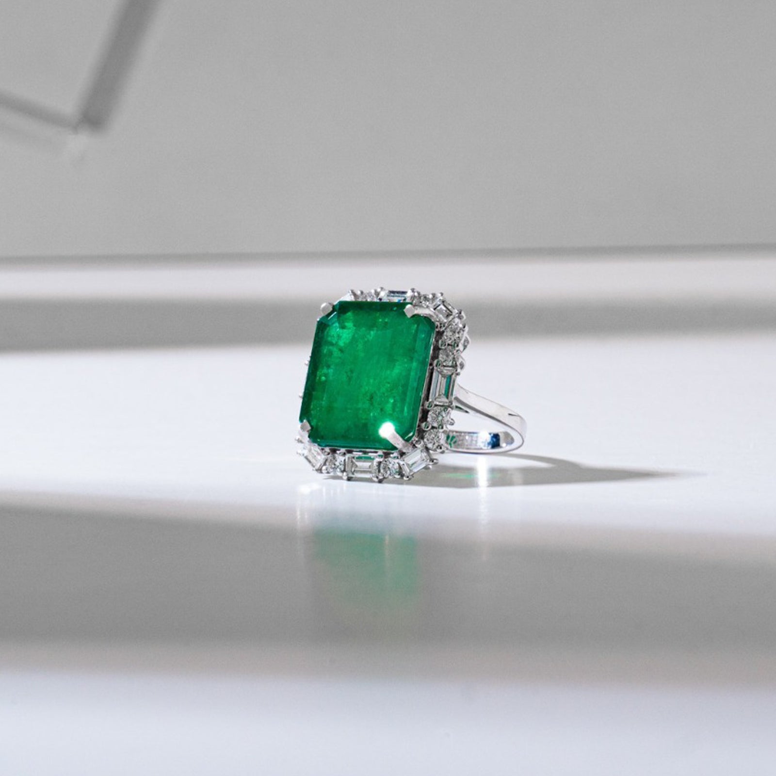 Emerald and baguette diamond ring