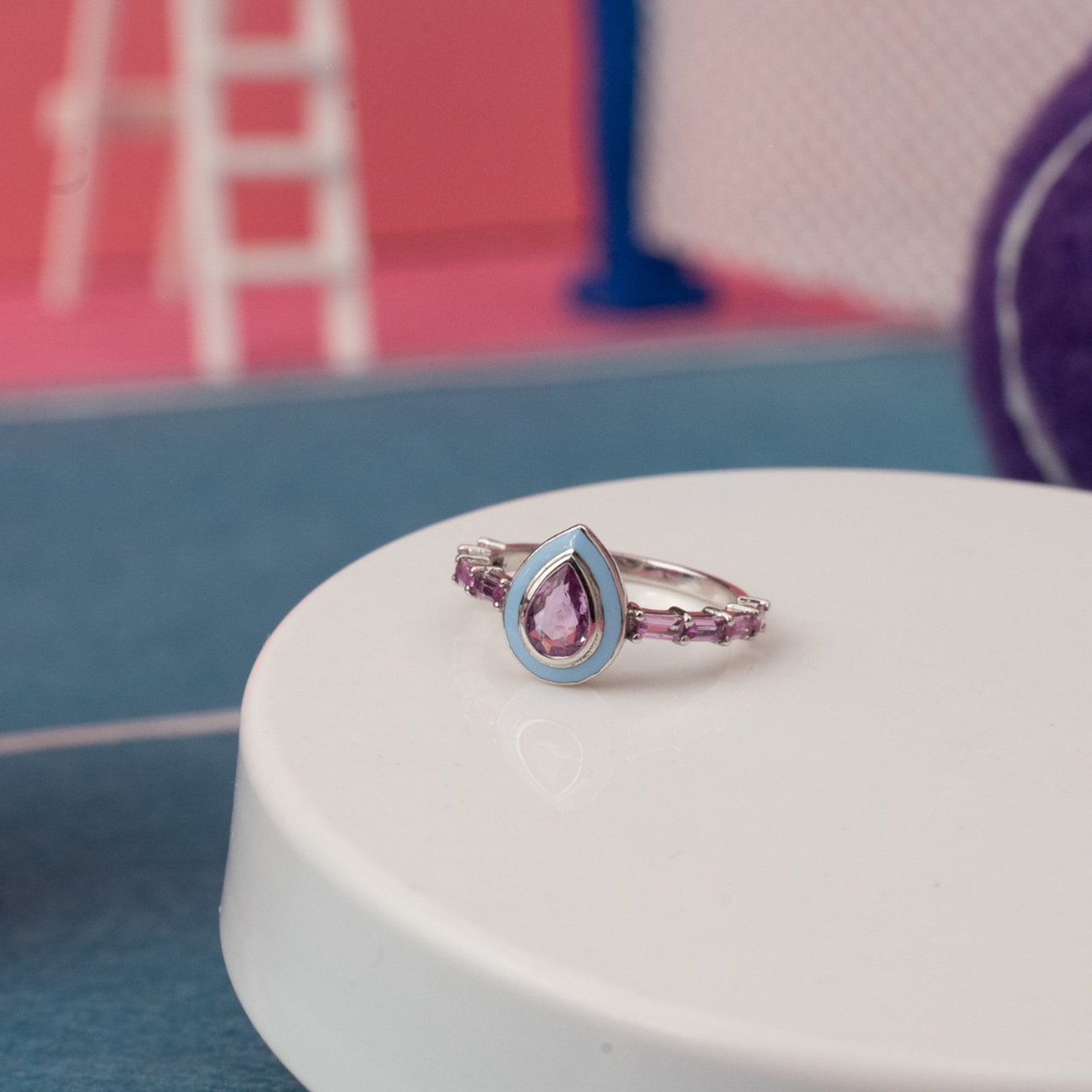 Pink sapphires with blue enamel